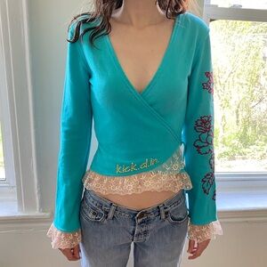 Blue Wrap Blouse with Embroidery and Lace Hem